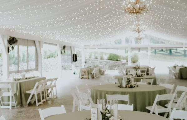 Venue Category Vendor Gallery Moonstone Manor a white tent with tables and chairs