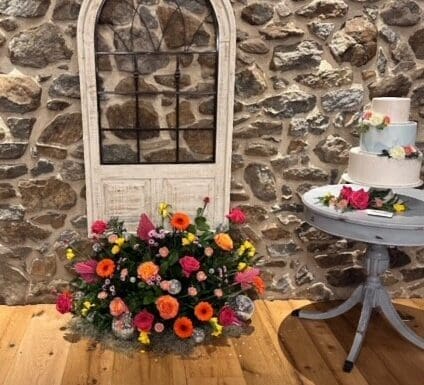 Room Facilites Moonstone Manor a door with flowers and a table Gallery 6